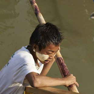 Becoming a boatman in a very young age. Mandalay, Myanmar