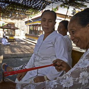 priestesses using slingshots to keep the monkys on a distance, north Bali