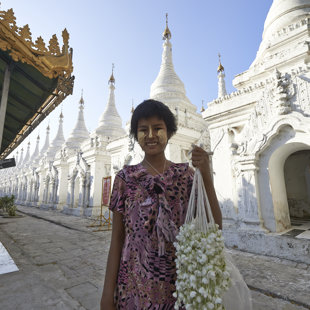 Every day this girl sells flowers.  Mandalay, Myanmar
