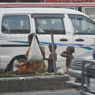 Desperation - family making a living in the trafic jam, Dhaka Bangladesh 2015